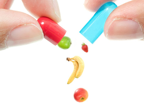 Pillerkapslar som det ramlar ut frukter ur