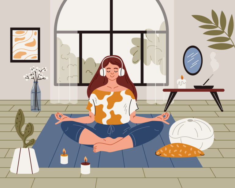 Kvinna mediterar med ögonen slutna och benen i kors