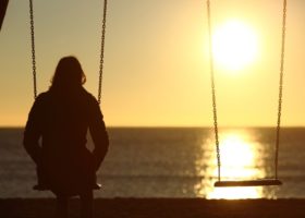 lonely-woman-watching-sunset-alone-in-winter-picture-id493659014 (1)