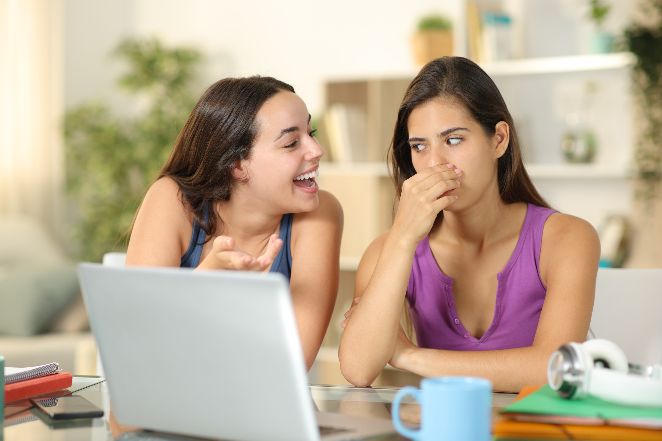 Woman with bad breath talking to friend