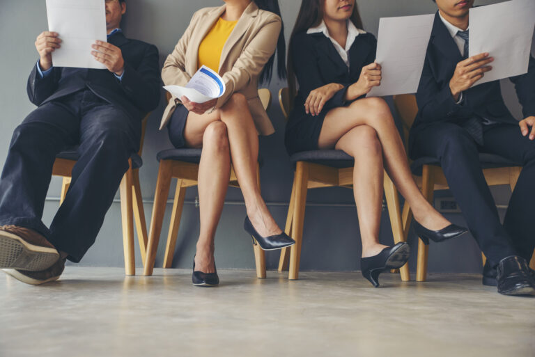 Group of business people waiting job interview. Asian businesswoman and businessman sitting and reviewing document prepare for vacancy interview.